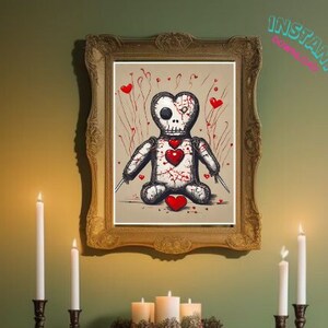 May include: A framed illustration of a voodoo doll with a skull face, stitched-up body, and red hearts. The doll is sitting with its legs crossed and holding a knife in each hand. The background is a light brown color with red hearts and red splatters.