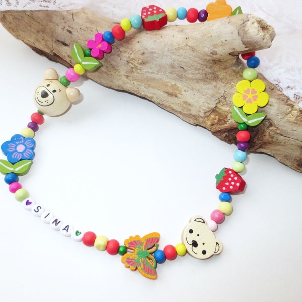 Children's necklace made of wooden beads, large bear, blossoms, flowers, leaves, colorful, elastic, approx. 45 cm, customizable, with or without name