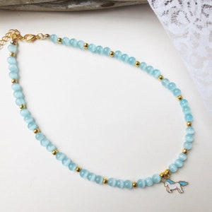 Necklace with unicorn pendant, cat-eye glass beads, turquoise, gold-colored, 39 cm plus extension chain, customizable