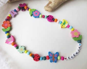 Children's necklace made of wooden beads, blossoms, flowers, leaves, beetles, butterflies, colourful, elastic, approx. 44 cm, personalisable, with or without name