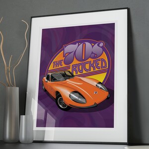 May include: A framed print with a purple background and a vintage orange sports car. The car is in front of a yellow circle with the text "The 70s Rocked" in purple and orange.