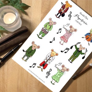 May include: A set of printable stickers featuring cute mice playing musical instruments. The mice are dressed in colorful outfits and are playing a variety of instruments, including a drum, a flute, a cello, and a clarinet. The stickers are perfect for adding a touch of whimsy to your planner, journal, or scrapbook.