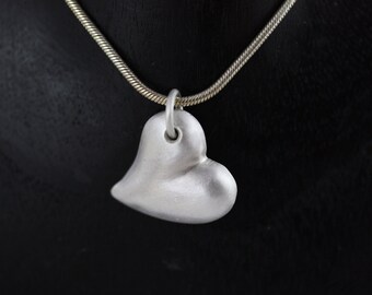 Shapely matt heart half made of 925 silver, engraved on the back