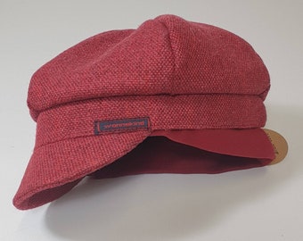 Peaked cap with ear warmers for children, wool mix lined with cotton, cotton cuffs.