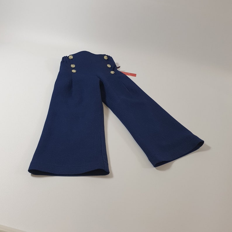 Children's jeans pants, sailor jeans made of dark blue cotton denim for boys and girls. image 2