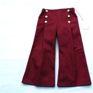 Children's trousers in maritime still, sailor trousers Fiete in dark red-burgundy, with wide leg, right and left sailor's bib with buttons. image 2