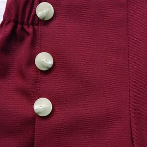 Children's trousers in maritime still, sailor trousers Fiete in dark red-burgundy, with wide leg, right and left sailor's bib with buttons. image 3