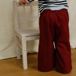 Children's jeans pants, sailor jeans made of dark blue cotton denim for boys and girls. image 6