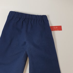 Children's jeans pants, sailor jeans made of dark blue cotton denim for boys and girls. image 3