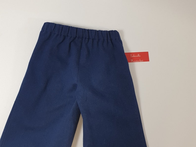 Children's jeans pants, sailor jeans made of dark blue cotton denim for boys and girls. image 3