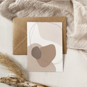 May include: Abstract art print with a white background and brown, beige, and gray shapes. The shapes are organic and flowing, creating a modern and minimalist design.