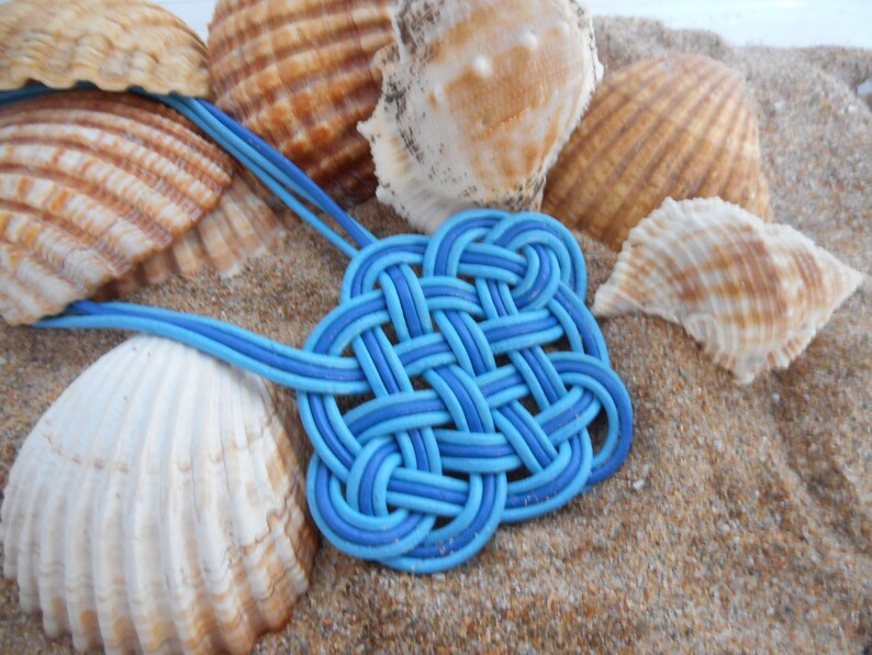 Blue pendant with a Celtic knot in natural leather short necklace with leather pendant
