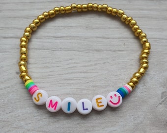 SMILE bracelet with golden rocailles name bracelet desired text