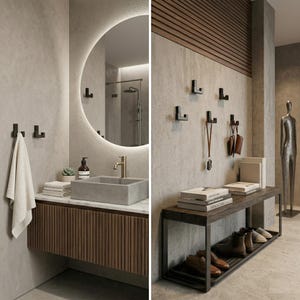 Puede incluir: Interior de baño moderno con espejo redondo, lavabo de hormigón y mueble de madera. Hay ganchos negros en la pared. Un banco con zapatos y libros está en el pasillo. Una toalla cuelga de un gancho.