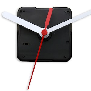 May include: A clock mechanism with a black face and white hands. The hour hand is red.