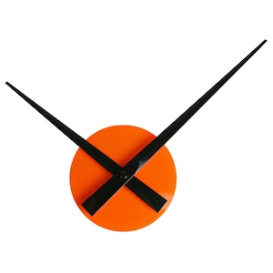 May include: A modern wall clock with black hands and an orange circular face.