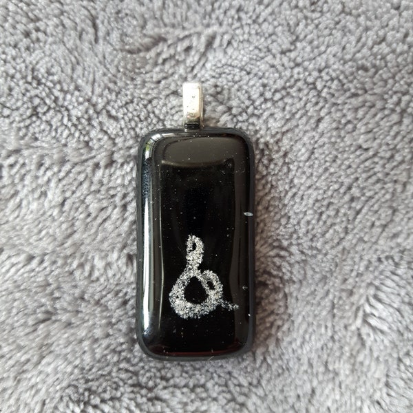 Black glass pendant with "&" sign, glass fusing