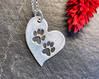 Heart pendant with stamped paw prints, 999 silver, patinated
