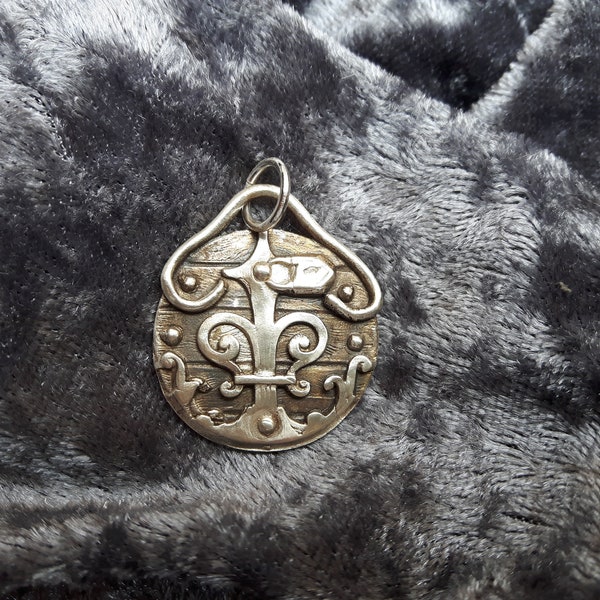 Amulet of 999 silver patinated with beautiful texture