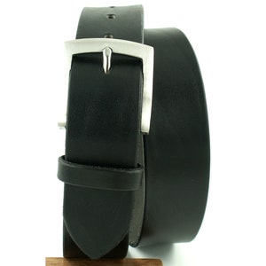 May include: A black leather belt with a silver buckle. The belt is rolled up and the buckle is visible.