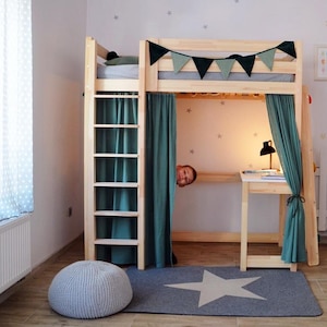 May include: A wooden loft bed with a green curtain and a desk underneath. The bed has a ladder on the side and a white star rug on the floor.