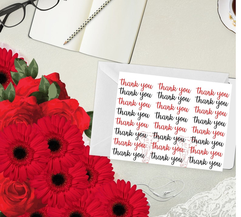 May include: A white envelope containing a sheet of paper printed with the words "thank you" in red and black script. The image also features a bouquet of vibrant red flowers, a notebook, and a pair of glasses.