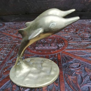 Pair of dolphins in brass