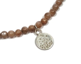 Moonstone necklace made of round beads in pink nude with circle pendant and clasp, hammered silver chain with small pendant chain pendant