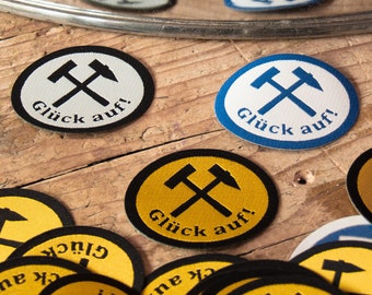 Good luck! Mining label 5 x 4 cm in black/white, blue/white, yellow/black with hammer and chisel.