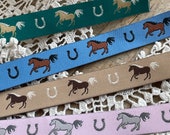 Weaving ribbon galloping horses pink sky blue petrol beige