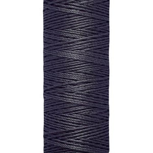 May include: A spool of Gütermann thread in a dark blue colour. The spool is labelled with the brand name and the length of the thread: 30 m - 33 yds/vgs.