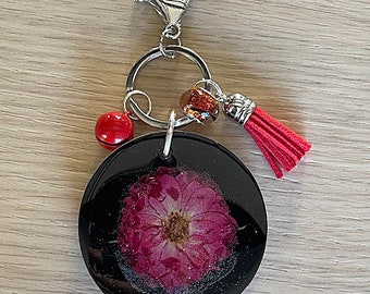 round black resin key ring and red inclusion flower