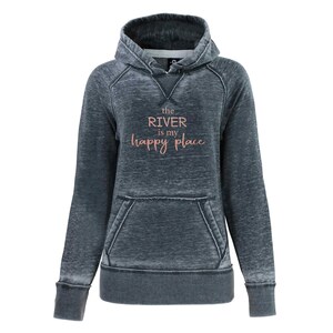 May include: A dark gray hooded sweatshirt with a distressed look. The text "the RIVER is my happy place" is printed in pink on the front.