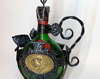 German wine bottle in a stand 1960s vintage shabby