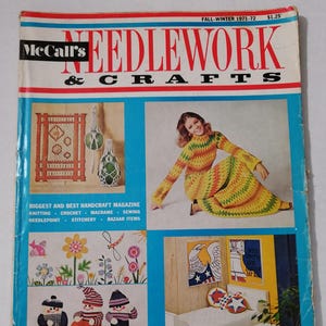 May include: A vintage McCall's Needlework & Crafts magazine from Autumn-Winter 1971-72. The cover shows a woman in a yellow, green, and orange crocheted outfit, plus images of crafts and needlework projects. The magazine's title is in red and black.