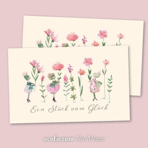Könnte beinhalten: Eine Karte mit einer Aquarell-Illustration von rosa Blumen und kleinen Figuren, die Blumen halten. Der Text auf der Karte lautet "Ein Stück vom Glück" und "acufractum Ute Menze".