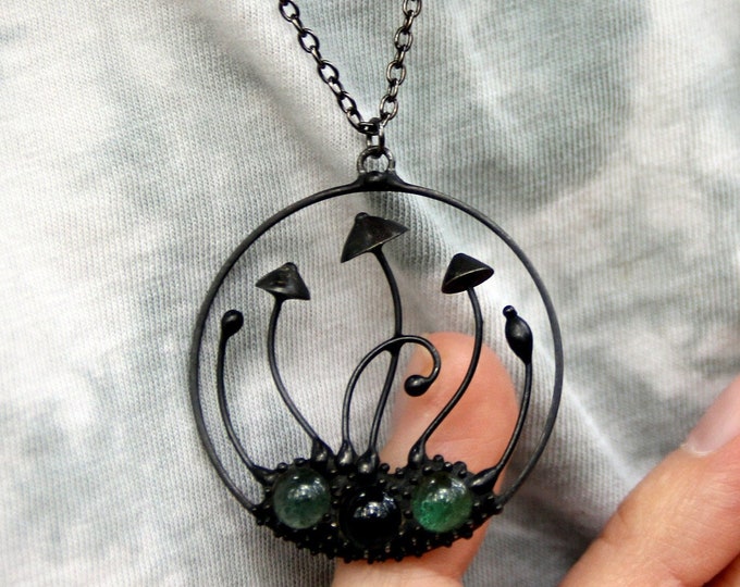 Handmade mushrooms round metal black pendant with green glass, wild nature festival rave clothing, shrooms jewelry.