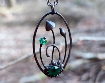 Handmade psylocibe magic mushrooms metal oval necklace with green glass, inspired by wild forest fairy witch woodland elven jewelry.