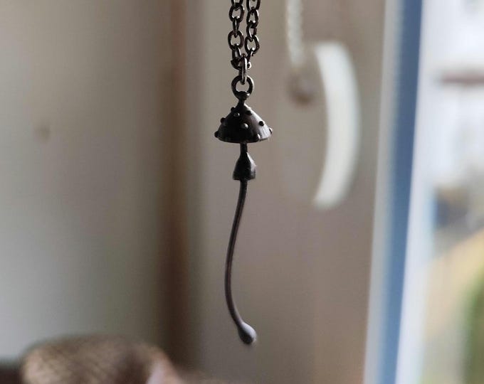 Handcrafted amanita muscaria forest fungi small metal necklace inspired by wild nature fly agaric mushroom pendant, hippie aesthetic.