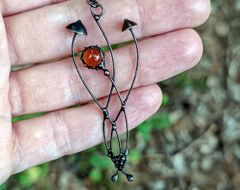 Small metal pendant forest magic mushrooms with brown glass, botanical nature fungi mushroom jewelry, psychedelic aesthetic art.