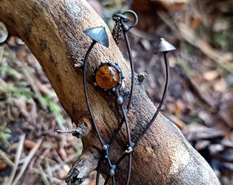 Small metal pendant forest magic mushrooms with brown glass, botanical nature fungi mushroom jewelry, psychedelic aesthetic art.