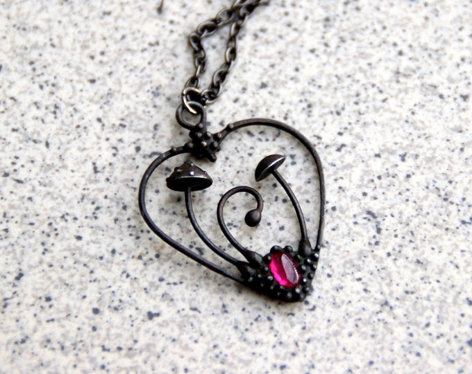 Handmade metal magic mushrooms amanita muscaria necklace with garnet, woodland heart unusual gift for her, foreststyle toadstools jewelry.