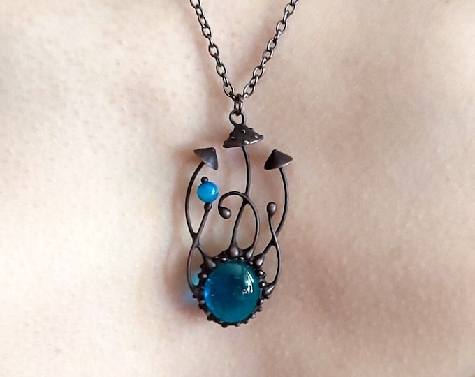 Forest fly agaric magic mushroom inspired by nature handmade metal pendant with blue glass, amanita muscaria forest nation design jewelry.
