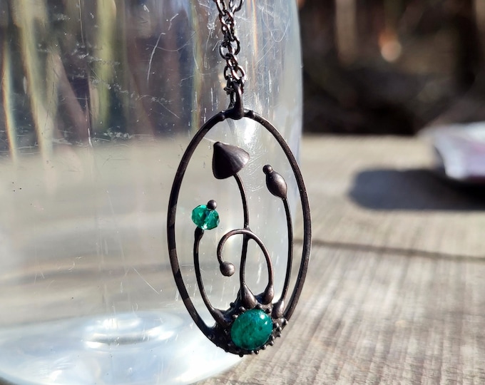 Handmade psylocibe magic mushrooms metal oval necklace with green glass, inspired by wild forest fairy witch woodland elven jewelry.