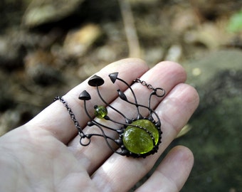 Forest style boho botanical necklace handmade metal magic mushrooms with green glass, inspired by nature unusual gift fungi pendant.