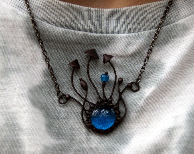 Woodland toadstools mushrooms inspired by nature handmade black metal pendant with blue glass, psychedelic forest unusual design jewelry.