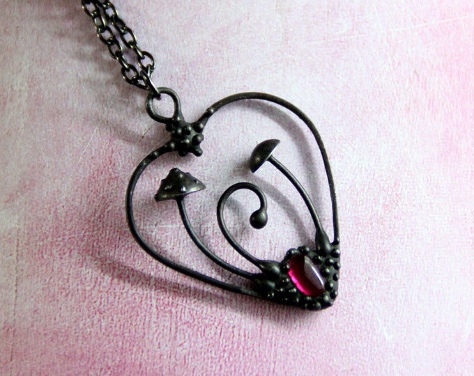 Handmade metal magic mushrooms amanita muscaria necklace with garnet, woodland heart unusual gift for her, foreststyle toadstools jewelry.