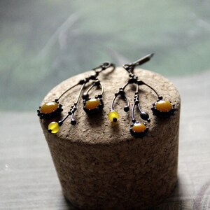 Unusual boho hippie asymmetric forest tree branch earrings with yellow stained glass. Size about 6/3 cm (2.36*1.18 in). Color: black/yellow.