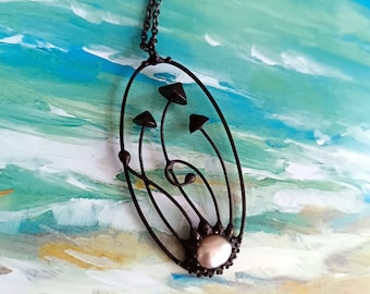 Wild nature psychedelic design handcrafted metal magic mushrooms necklace with pearl, inspired by forest fungi unusual botanical jewelry.