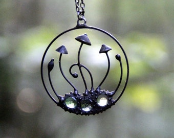 Handmade mushrooms round metal black pendant with green glass, wild nature festival rave clothing, shrooms jewelry.